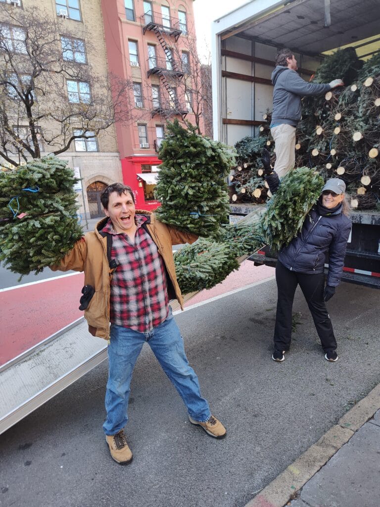 Bryce and Tracy of Tree Riders NYC with a Christmas tree delivery in Manhattan
