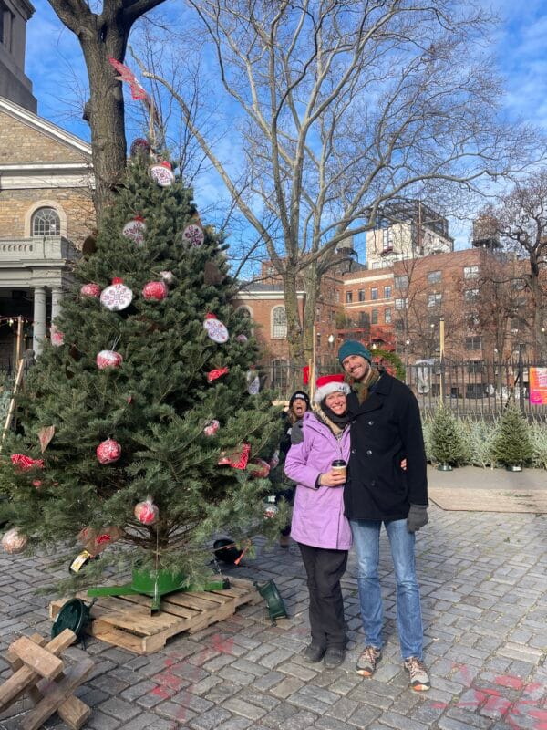 Christmas tree decorated with ornaments at the Tree Riders NYC stand in the East Village